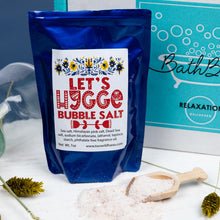 Load image into Gallery viewer, Bag of &#39;Let&#39;s Liggge Bubble Salt&#39; with a decorative label on a white surface with a blue background.
