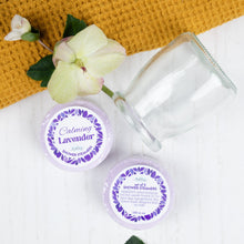 Load image into Gallery viewer, Two glass jars with lavender-themed labels on a white surface with a yellow woven mat.