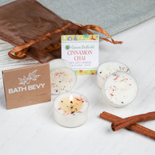 Load image into Gallery viewer, Bath Bevy cinnamon chai candles with packaging and cinnamon sticks on a white surface