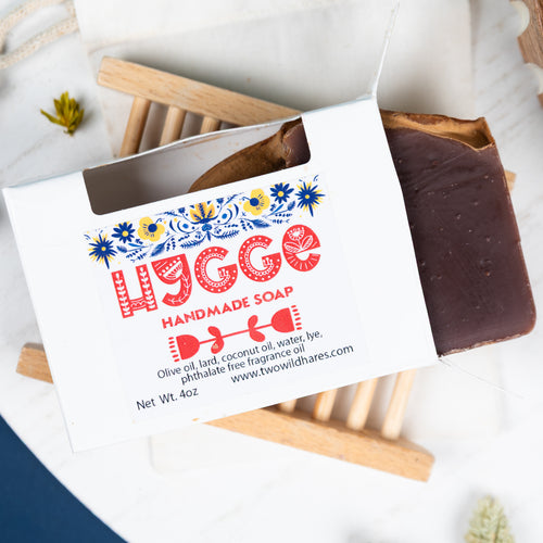 Handmade soap bar with a decorative label on a white background