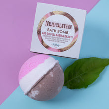 Load image into Gallery viewer, Neapolitan bath bomb with packaging on a pink and blue background