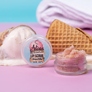 Lip scrub container with pink contents, waffle cone, and ice cream on a colorful background