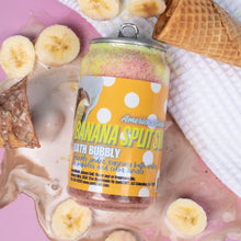 Load image into Gallery viewer, Can of Banana Split Bubbly bath product with banana slices and a waffle cone on a pink surface.