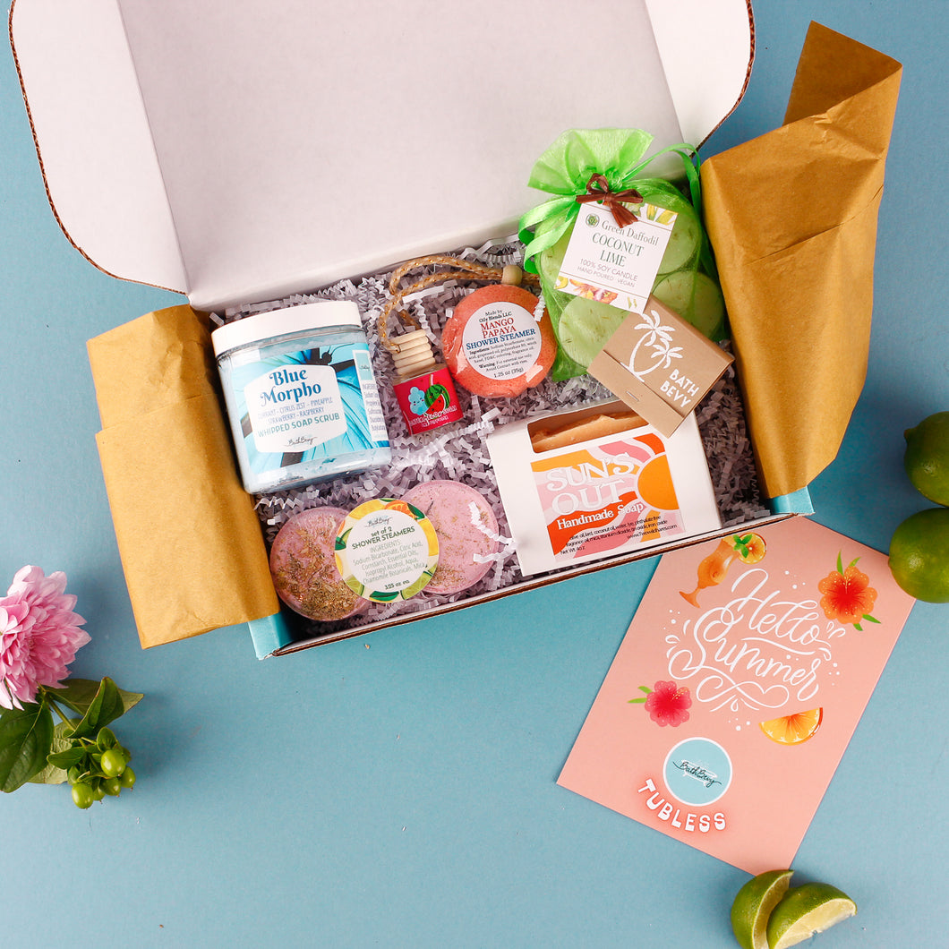 Open gift box with various items on a blue background