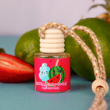 Load image into Gallery viewer, Car diffuser with watermelon design on a blue surface with fruits in the background