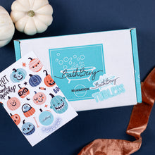 Load image into Gallery viewer, BathBevy product box with Halloween-themed stickers on a dark blue background