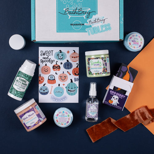 Collection of Halloween-themed bath and body products on a dark surface with a 'Bathberry' branded box.