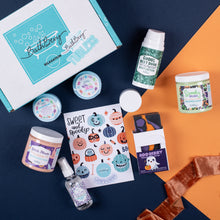 Load image into Gallery viewer, Bath and body products with Halloween-themed packaging on a blue and orange background