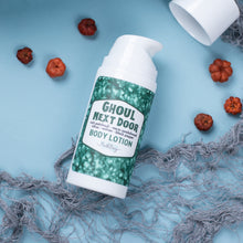 Load image into Gallery viewer, Body lotion bottle labeled &#39;Ghoul Next Door&#39; on a textured blue surface with decorative elements.
