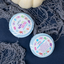 Load image into Gallery viewer, Two small containers with colorful labels on a dark textured surface.