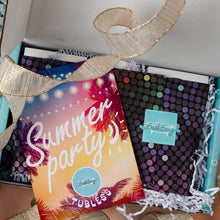 Load image into Gallery viewer, A gift box from Bath Bevy featuring a colorful 'Summer Party' card, a black polka-dot notebook, and a turquoise tag, styled with a gold ribbon.