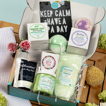 Load image into Gallery viewer, Bath product set including bath bombs, tea, and salts in a box with decorative elements.