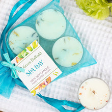 Load image into Gallery viewer, Set of three green candles in a blue mesh bag with a 'Green Daffodil Spa Day' label on a textured surface.