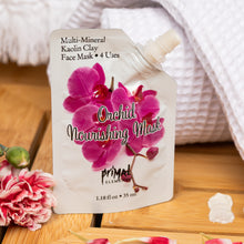 Load image into Gallery viewer, Orchid nourishing mask packaging with pink flowers on a wooden surface