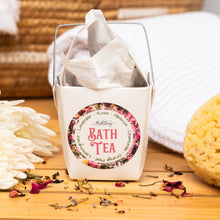 Load image into Gallery viewer, Bath tea packaging with a label on a wooden surface with bath accessories.
