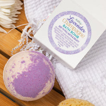 Load image into Gallery viewer, Lavender bath bomb with packaging on a wooden surface
