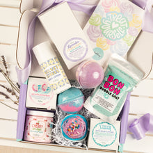 Load image into Gallery viewer, Assorted bath products including bath bombs and body wash in a decorative box with ribbons.