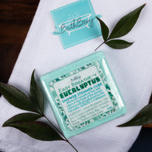Load image into Gallery viewer, BathBevy Eucalyptus shower steamer cube with a leafy background