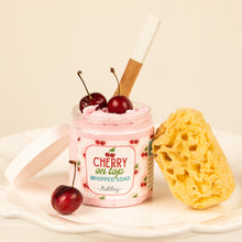 Load image into Gallery viewer, Pink whipped soap in a jar with cherries and a sponge on a beige background