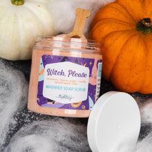 Load image into Gallery viewer, A jar of whipped soap scrub labeled 'Witch, Please' sits on a dark surface with a white lid beside it, styled with pumpkins and white faux fur. The scrub inside appears peachy pink, and the label is purple with decorative Halloween-themed graphics.