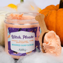Load image into Gallery viewer, A jar of Bath Body 'Witch, Please' whipped soap scrub with a wooden scoop holding orange scrub, styled with pumpkins and white faux fur.