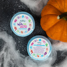 Load image into Gallery viewer, Two 'Wake the Dead' shower steamers in Peppermint scent, styled on a dark textured surface with white faux fur and a small orange pumpkin.