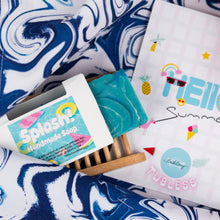 Load image into Gallery viewer, Handmade soap with 'Splash' branding on a blue and white patterned background