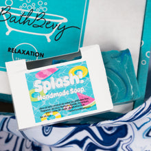 Load image into Gallery viewer, Handmade soap with 'Splash!' label and BathBevy packaging in the background