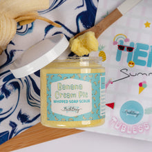 Load image into Gallery viewer, Jar of Banana Cream Pie whipped soap scrub with a 'Hello Summer' towel in the background
