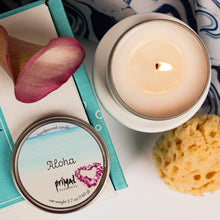 Load image into Gallery viewer, Candle, jar labeled 'Aloha', and bath bomb with decorative elements on a white surface