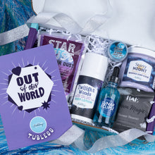 Load image into Gallery viewer, A curated spa gift box filled with beauty products, including Twilight Woods body lotion, Lunar Eclipse body oil, Star Dust Steamer Dust, and Moon Magic shower steamer, arranged in a white box with purple packaging and a purple 'Out of This World' card.