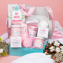 Load image into Gallery viewer, Gifting box with bath bombs, soaps, and a candle on a pink background