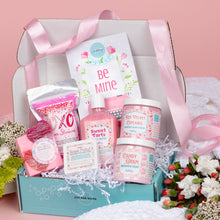 Load image into Gallery viewer, Gifting box with pink-themed products on a pink background