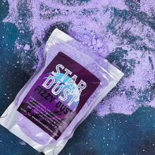 Load image into Gallery viewer, A clear resealable pouch of Star Dust Fizzy Dust, shown at an angle on a dark blue and purple starry space background with loose purple powder scattered around.