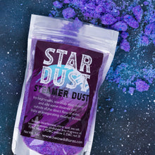 Load image into Gallery viewer, A clear stand-up pouch labeled 'STAR DUST STEAMER DUST' filled with purple powder, placed on a dark blue starry background with scattered purple powder around it.