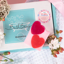 Load image into Gallery viewer, Heart-shaped soap on a box with 'Bath Bevy' branding, surrounded by flowers.