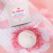 Load image into Gallery viewer, Bath bomb with packaging on a pink and white textured surface